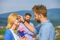 Couple in love dating while jealous husband fixedly watching on background. Unrequited love concept. Lovers meeting Royalty Free Stock Photo