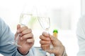 Couple in love drinking champagne - close up on hands