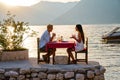 Couple in love drinking champagne wine on romantic dinner at sunset on the beach Royalty Free Stock Photo