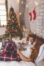 Couple having video call with family using tablet computer on Christmas morning Royalty Free Stock Photo