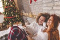 Couple having video call with friends using tablet computer on Christmas morning Royalty Free Stock Photo