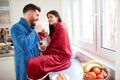 Couple in love drinking coffee in kitchen