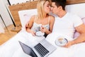 Couple in love drinking morning coffee in bed Royalty Free Stock Photo