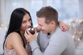 Couple in love eating sweet cake