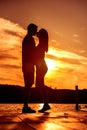 Couple Love Embrace, silhouette at sunrise Royalty Free Stock Photo