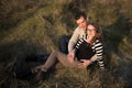 Couple in love on engagement day in natural park. Royalty Free Stock Photo