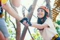 Couple in love enjoy active leisure in extreme rope park Royalty Free Stock Photo