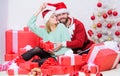 Couple in love enjoy christmas holiday celebration. Opening christmas present. Pleasant surprise. Couple sit near pile