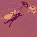 Couple in love flying with umbrellas Royalty Free Stock Photo