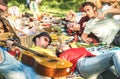 Couple in love with friends group having fun cheering at bbq picnic Royalty Free Stock Photo