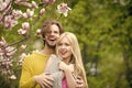 Couple in love. girl and guy, couple in love in spring magnolia flowers Royalty Free Stock Photo