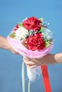 Couple love hand holding Beautiful Roses Flowers bouquet. Valentine day and wedding ceremony concept Royalty Free Stock Photo