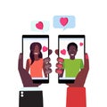 Couple in love hands holding smartphones happy valentines day concept african american man woman lovers chat bubble Royalty Free Stock Photo