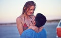 Couple, love and happy at the beach on date, vacation or road trip in summer at sunset, together and romantic adventure Royalty Free Stock Photo