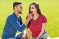 couple in love have fun in the park and drink smoothies and eating fruit at a picnic Royalty Free Stock Photo