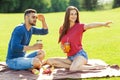 couple in love have fun in the park and drink smoothies and eating fruit at a picnic Royalty Free Stock Photo