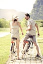 Couple in love have a ride with bicycles in the nature