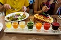 Couple in love are having dinner in a restaurant with beautiful dishes and a set of fresh juices Royalty Free Stock Photo