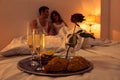 Couple in love having romantic supper in bedroom Royalty Free Stock Photo