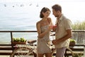 Couple in love having spritz time with Garda lake view