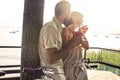 Couple in love having spritz time with lake view