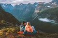 Couple in love hiking together romantic vacations with travel camping gear, Man and woman in sleeping bags Royalty Free Stock Photo