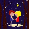 A couple in love hold hands under a streetlight in winter.A boy and a girl in winter under a street lamp