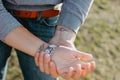 The couple in love holding hand in hand. Paired tattoo initials on the arms