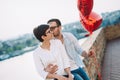 Couple in love holding red baloons hearts on valentine day Royalty Free Stock Photo