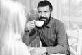 Couple in love holds cups of coffee at table Royalty Free Stock Photo