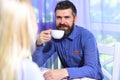 Couple in love holds cups of coffee at table Royalty Free Stock Photo