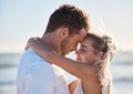 Couple, love and hug on beach eyes closed, smile and happy for relax travel vacation or quality time together. Happiness Royalty Free Stock Photo