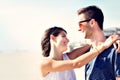 Couple in love hugging affectionately in front of the sea