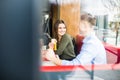 Couple in love hugging having fun, laughing and smiling together. Handsome boyfriend joke of her girlfriend and feed her, french f Royalty Free Stock Photo