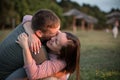 Couple in love hugging and kissing at the beach in the sunset Royalty Free Stock Photo