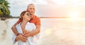 Couple in love hugging on the sandy exotic beach while they have a evening walk by the Trou-aux-Biches seashore on Mauritius Royalty Free Stock Photo