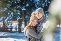 Couple in love hugs in winter forest Royalty Free Stock Photo