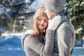 Couple in love hugs in winter forest Royalty Free Stock Photo