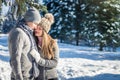 Couple in love hugs in winter forest Royalty Free Stock Photo