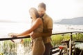 Couple in love joking in a terrace on the lake