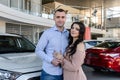 Couple in love with keys from new car Royalty Free Stock Photo