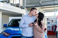 Couple in love with keys from new car Royalty Free Stock Photo