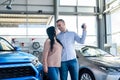 Couple in love with keys from new car Royalty Free Stock Photo