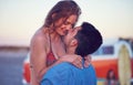 Couple, love and kiss at the beach on date, vacation or road trip in summer at sunset, together and romantic adventure Royalty Free Stock Photo