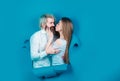Couple in love kiss in hole paper background. Discount and sale. Kissed couple of bearded man and happy woman making Royalty Free Stock Photo