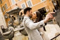 Couple in love kissing and takes selfi in Rome Royalty Free Stock Photo