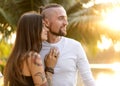 Couple in love laughing looking at each other in the Bangkok park  and tropical threes Royalty Free Stock Photo