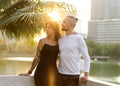 Couple in love laughing looking at each other in the Bangkok park  and tropical threes Royalty Free Stock Photo