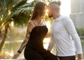 Couple in love laughing looking at each other in the Bangkok park  and tropical threes Royalty Free Stock Photo