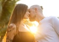 Couple in love laughing looking at each other in the Bangkok park  and tropical threes Royalty Free Stock Photo